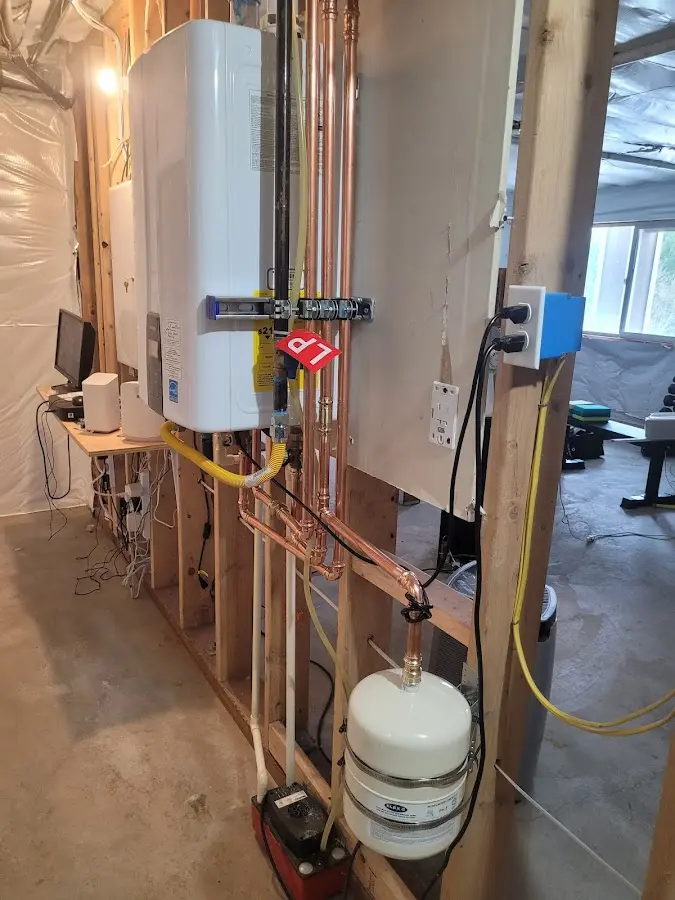 Licensed plumber repairing a kitchen sink in Dexter